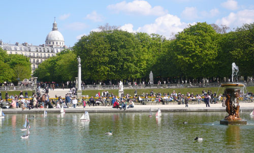 Parisians and tourists enjoying the Tuileries Gardens